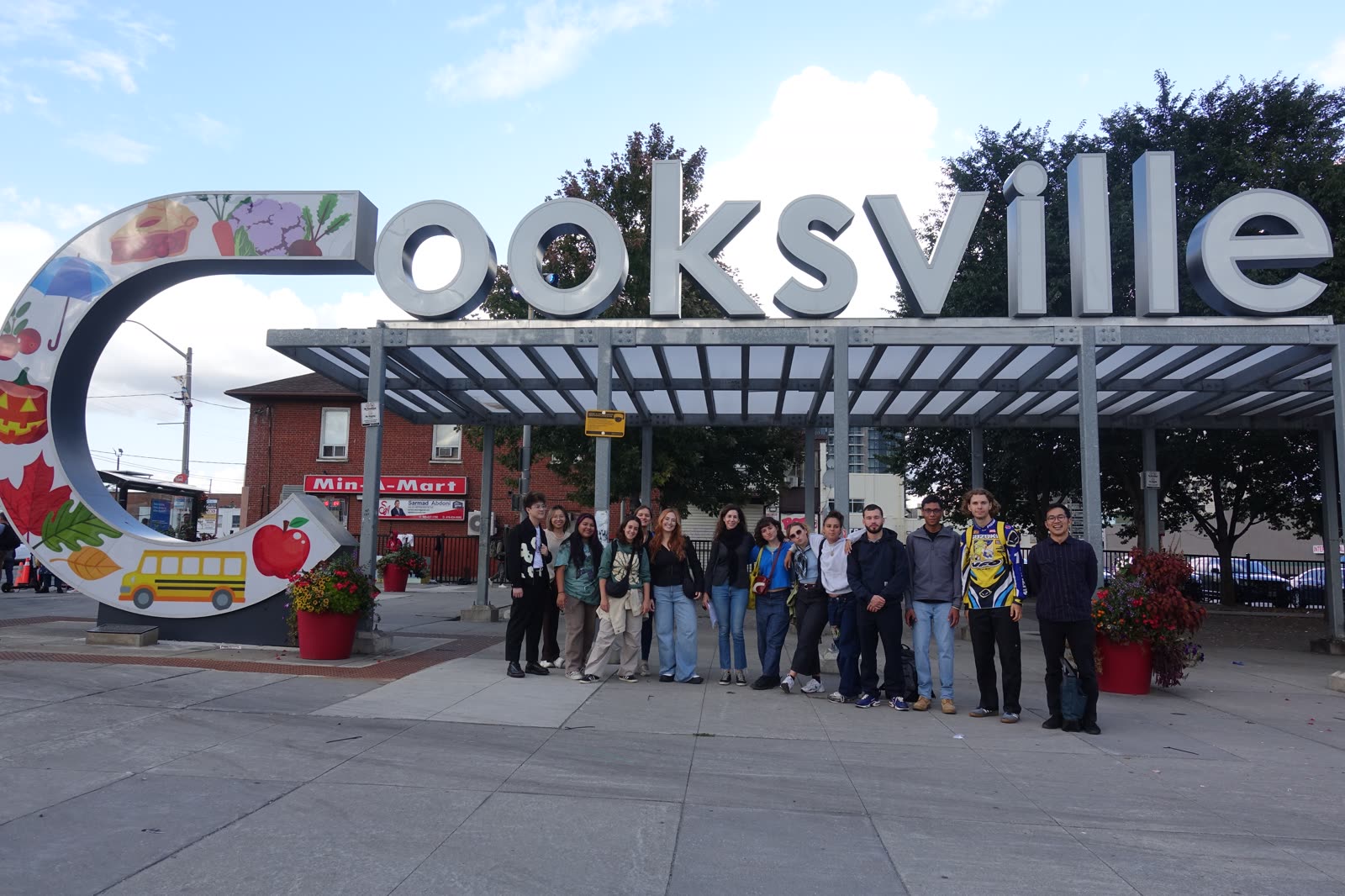 Jugraj and the design team at the Cooksville landmark sign