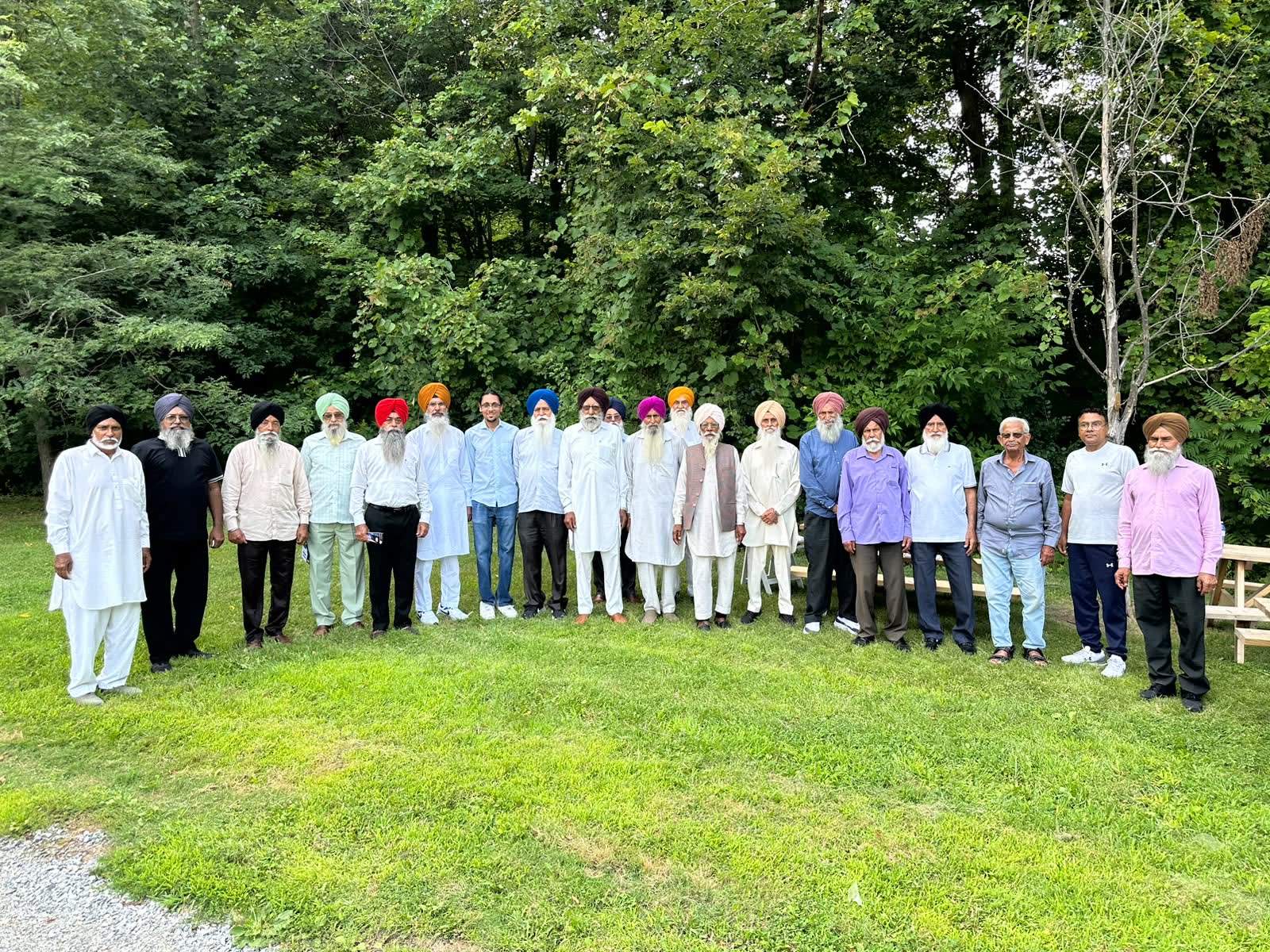 Jugraj with community elders gathered at a local park