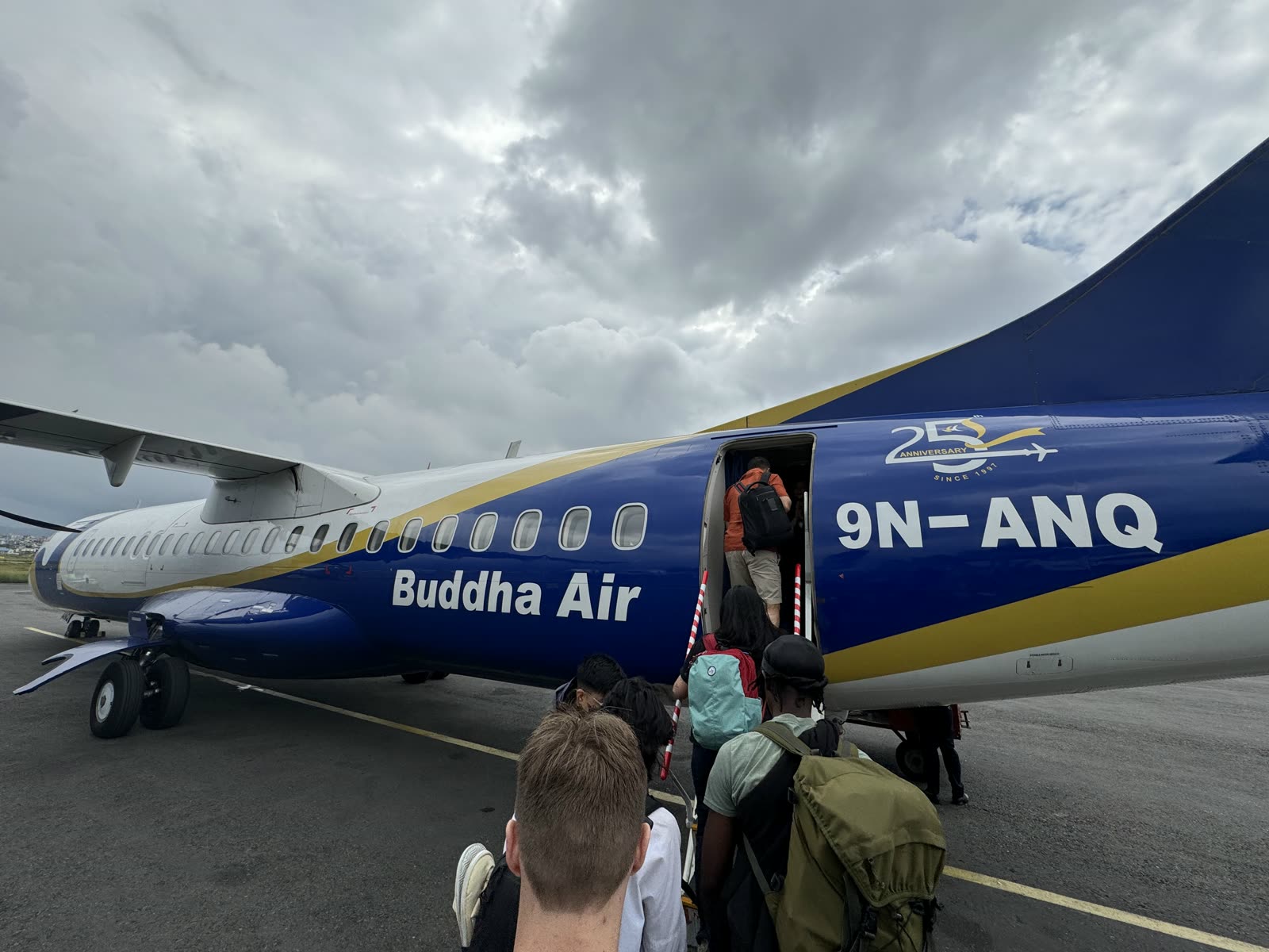 Jugraj and fellow students boarding a Buddha Air flight to Pokhara