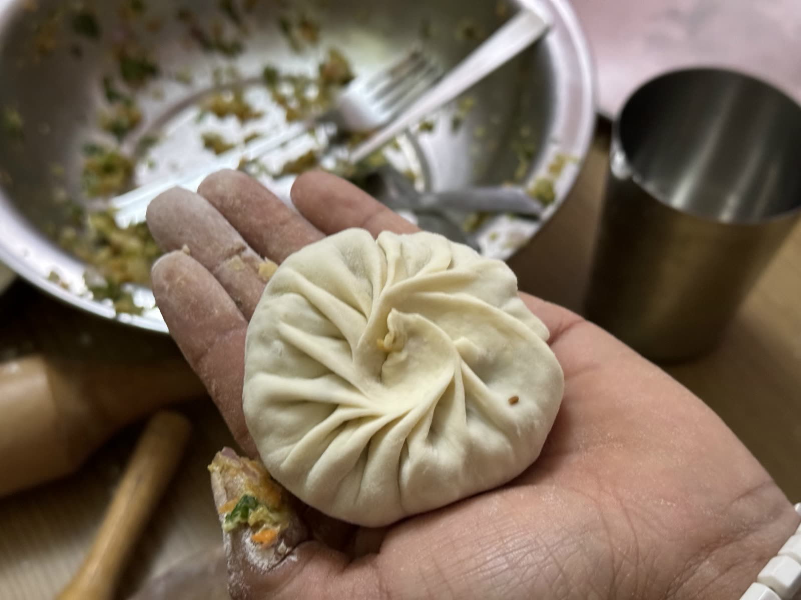 A freshly folded momo prepared during the visit