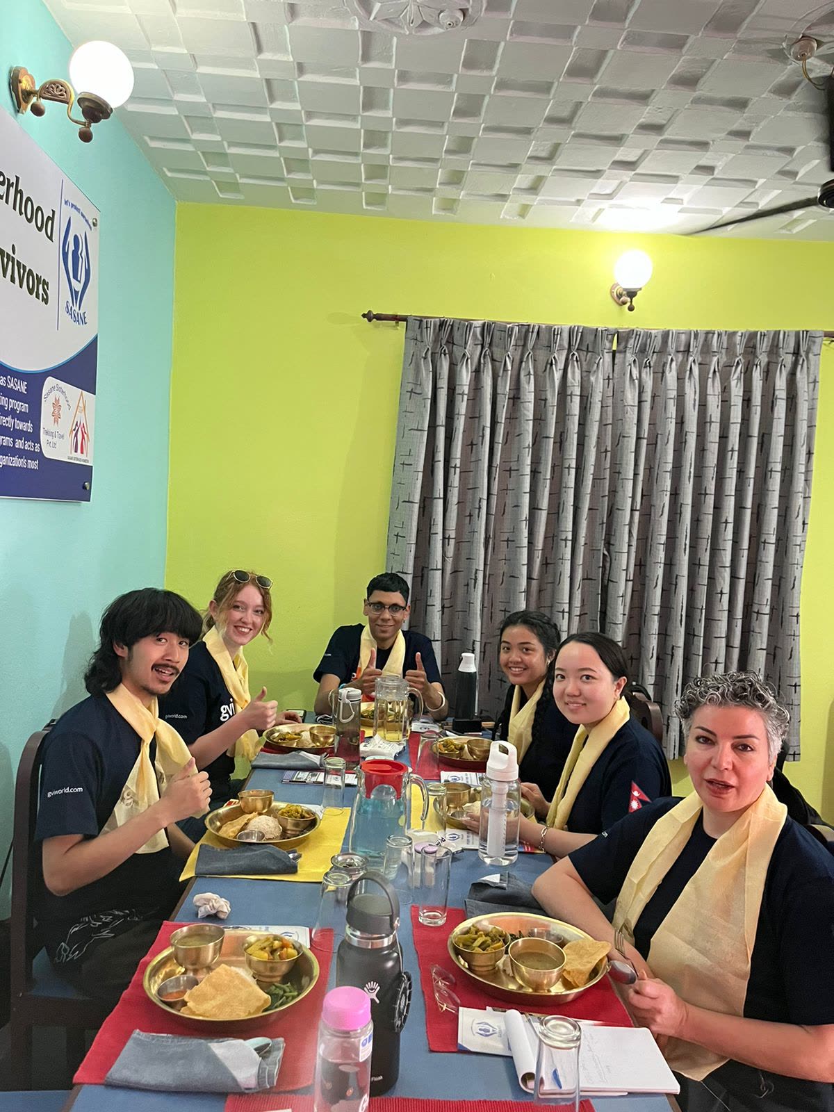 Sharing a traditional Nepali meal with the community