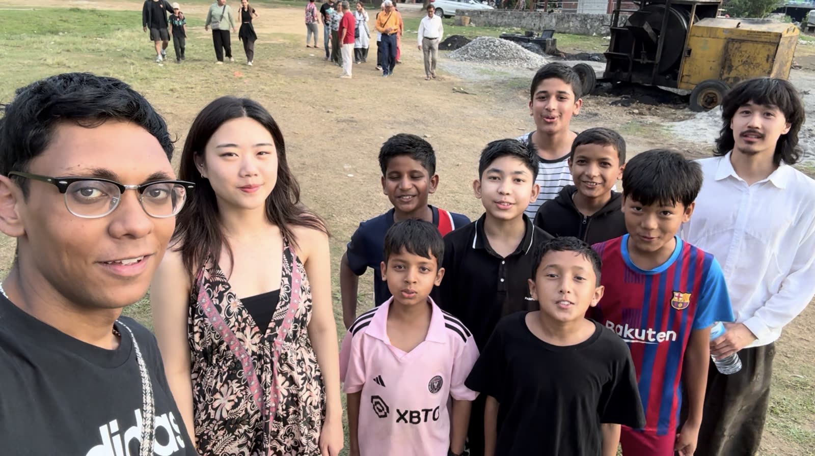 The student group together on a hillside in Pokhara
