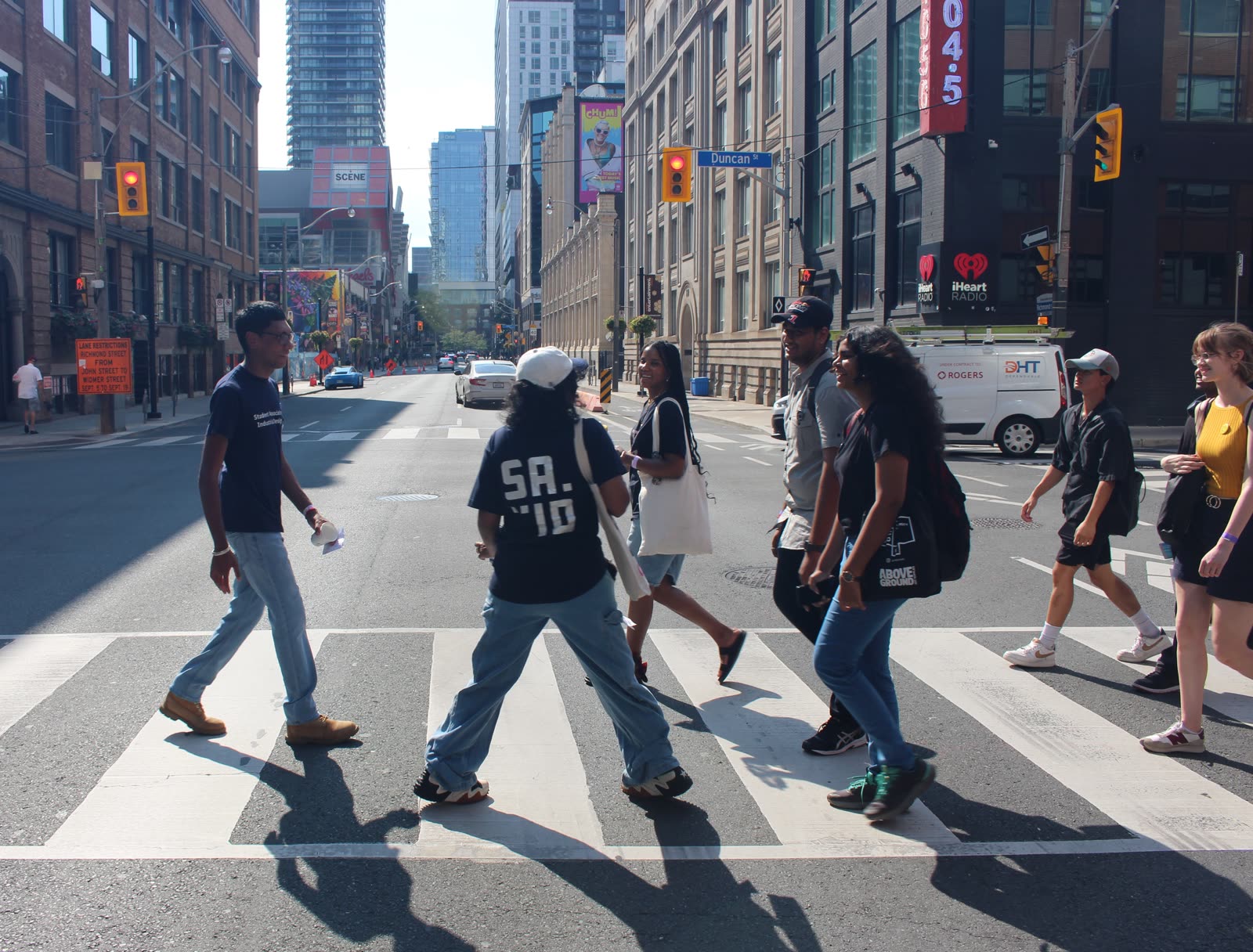 Jugraj and SAID members crossing a street in downtown Toronto