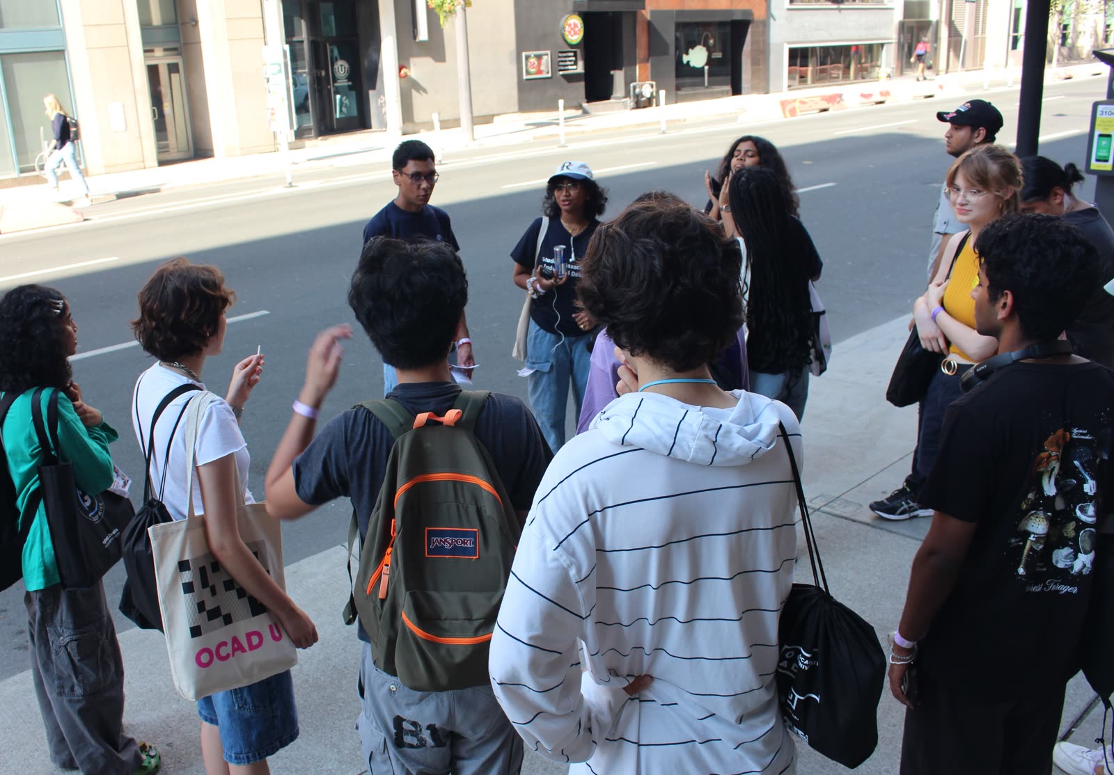Jugraj and SAID members gathered on a sidewalk during a campus tour